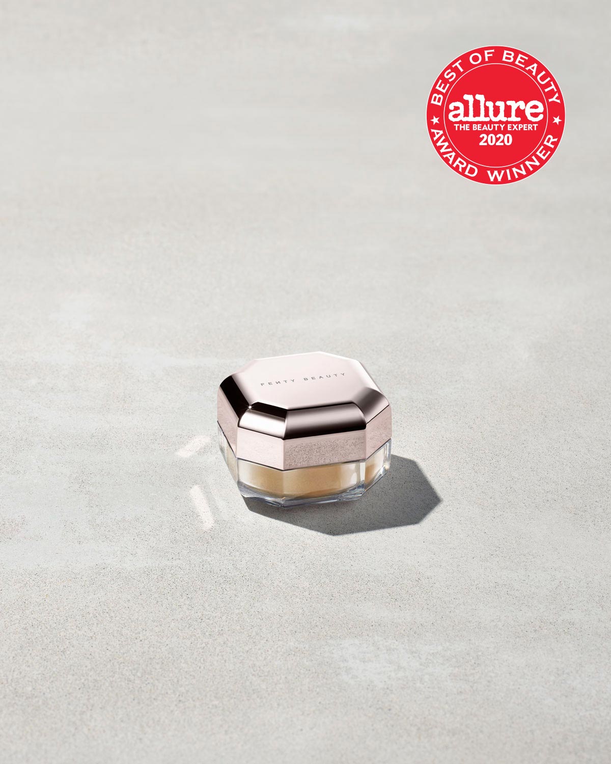 A jar of mini setting powder stood on a grey background